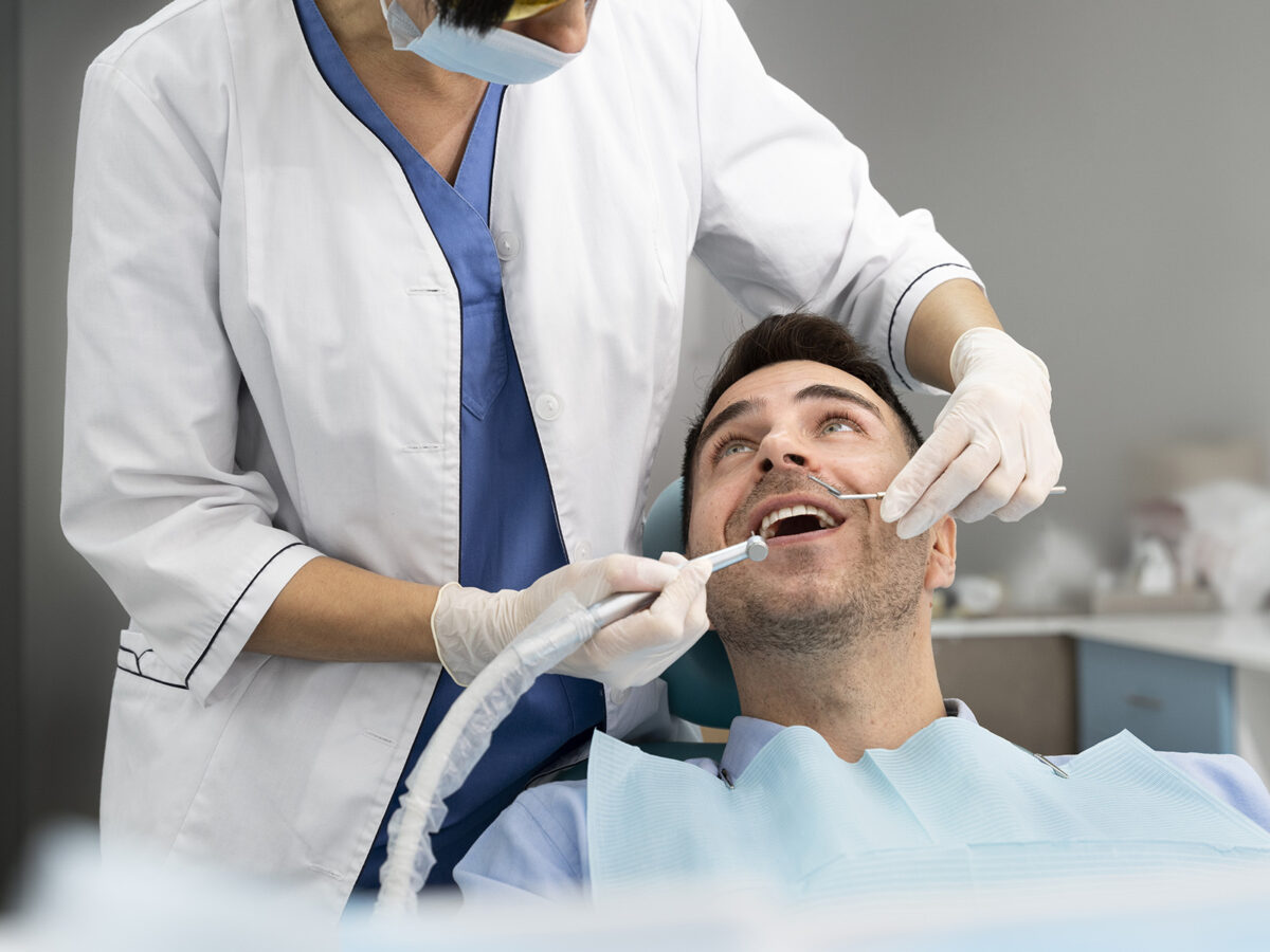 Dentist Fixes Braces with an Photopolymer Lamp in Dental Clinic